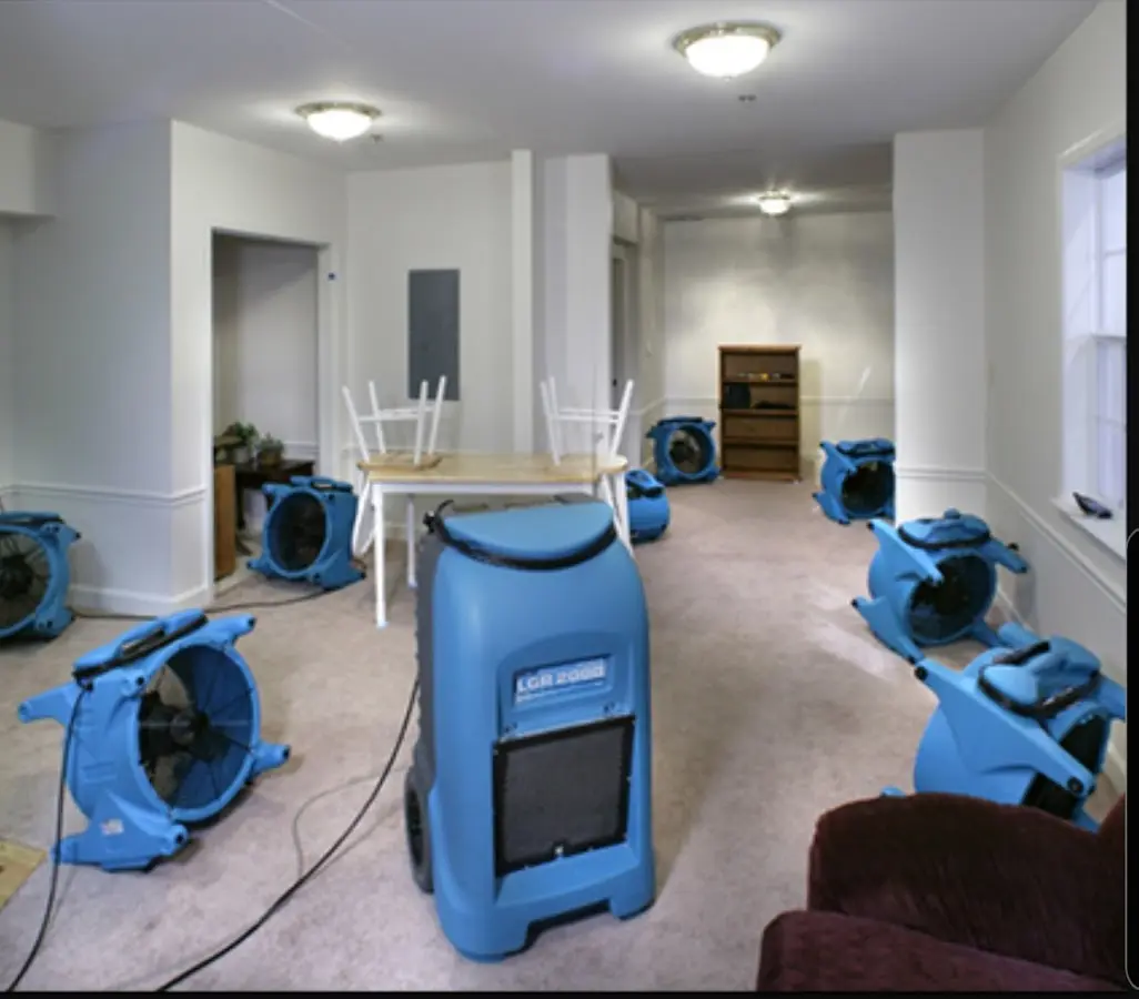 Air movers and dehumidifier setup for Water Damage Restoration in Berryville